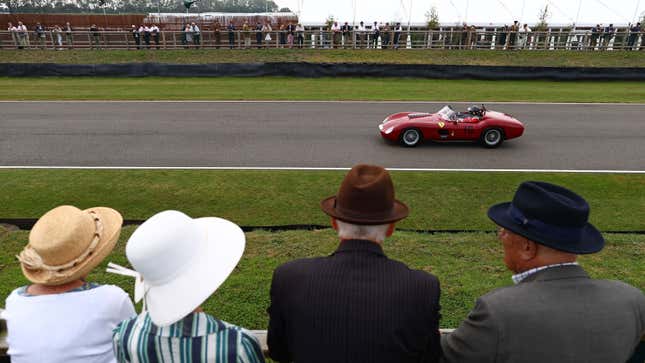 A photo of a classic Ferrari running at a track day. 