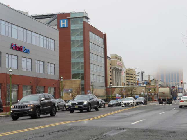 Cars drive along Atlantic Avenue in Atlantic City, N.J. on Jan. 26, 20245 past the AtlanticCare hospital and Caesars casino. Both those entities wanted a judge to block the city&#39;s plan to reduce the width of the street, the main artery through Atlantic City&#39;s downtown, from four lanes to two. But on Jan. 24, 2024 the judge refused to do so. (AP Photo/Wayne Parry)