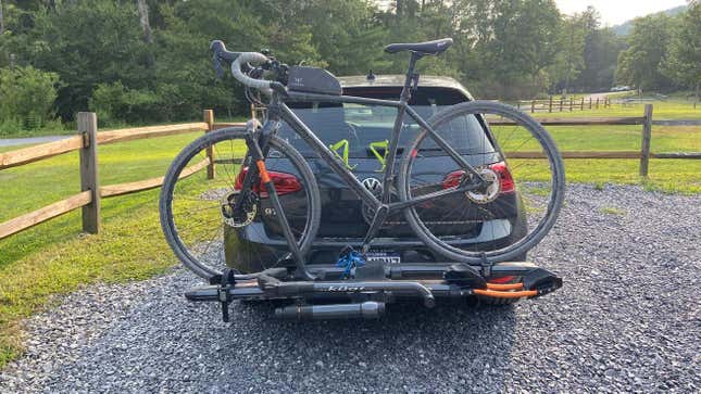 A bicycle mounted to a rear-mounted rack.