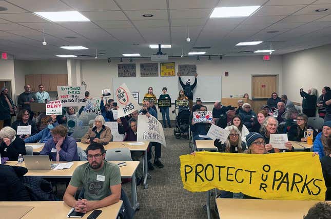 Protesters against fracking in state parks gathered for an Oil and Gas Land Management Commission meeting in Columbus, Ohio on Wednesday, Nov. 15, 2023. The commission voted to frack several state park and wildlife areas for oil and gas in a tense public meeting, much to the disappointment of Ohio environmental advocates. (AP Photo/Samantha Hendrickson)