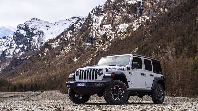 A photo of a white Jeep Wrangler SUV. 