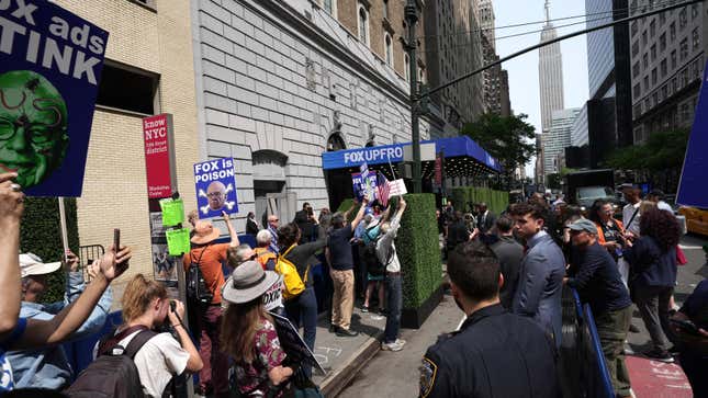 MoveOn activists protest at Fox Corp. Upfront with a message aimed at advertisers not to fund Fox News on May 15, 2023 in New York City. Advocacy group MoveOn is warning corporations that by advertising on Fox News they are enabling the spread of disinformation.
