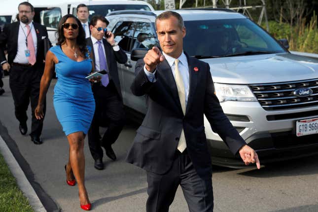 Former campaign manager Corey Lewandowski (C) says hello to reporters as he and White House advisors Sebastian Gorka (from L), Omarosa Manigault, White House Staff Secretary Rob Porter and Communications Director Anthony Scaramucci accompany President Trump for an event in Ohio in July.
