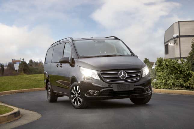 A black Metris parked on a road