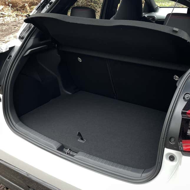 A photo of the trunk space in a Toyota Yaris hatchback. 