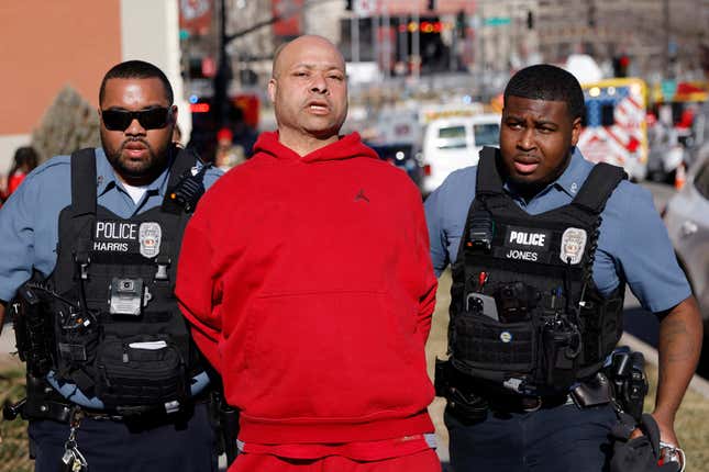 A man is detained by law enforcement following a shooting at Union  Station during the Kansas City Chiefs Super Bowl LVIII victory parade on  Feb. 14, 2024, in Kansas City, Missouri. 
