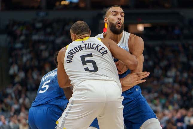 Nov 4, 2023; Minneapolis, Minnesota, USA; Minnesota Timberwolves center Rudy Gobert (27) sets a screen on Utah Jazz guard Talen Horton-Tucker (5) in the second quarter at Target Center.