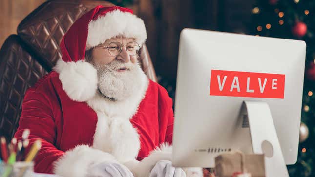Santa sits behind a computer at Valve doing some work. 