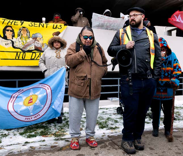 Joe Lafferty, of Iron Lightning, S.D., speaks to a group of Dakota Access Pipeline protesters outside The Radisson Hotel in Bismarck, N.D., on Wednesday, Nov. 1, 2023 prior to a U.S. Army Corps of Engineers public meeting on DAPL. (Darren Gibbins/The Bismarck Tribune via AP)