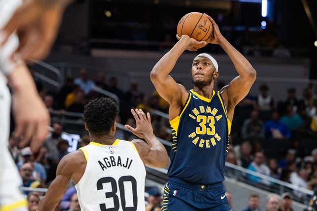 Nov 8, 2023; Indianapolis, Indiana, USA; Indiana Pacers center Myles Turner (33) shoots the ball while Utah Jazz guard Ochai Agbaji (30) defends in the second half at Gainbridge Fieldhouse.