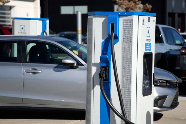 FILE - A charging station outside a Honda dealership on Nov. 12, 2023, in Highlands Ranch, Colo. The Biden administration is awarding $623 million in grants to help build an electric vehicle charging network across the nation. Grants being announced Thursday will fund 47 EV charging stations and related projects in 22 states and Puerto Rico, including 7,500 EV charging ports. (AP Photo/David Zalubowski, File)