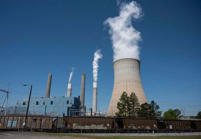 Steam rises from the Miller coal Power Plant in Adamsville, Alabama, on April 13, 2021. - The James H. Miller Jr. site faces no immediate shutdown threat and has the backing of many locals because of the jobs it offers — despite sending about as much planet-warming carbon dioxide into the sky last year as 3.7 million cars. 