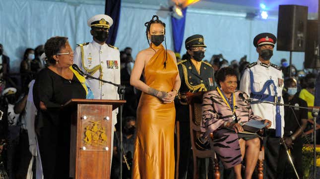 Barbados’s Prime Minister Mia Mottley (L) asks the country’s new President Sandra Mason (seated R) to make Barbadian singer Rihanna (C) the country’s 11th National Hero on November 30, 2021.