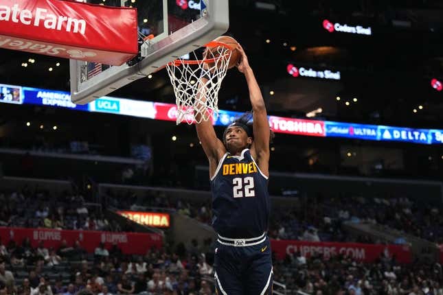 Oct 19, 2023; Los Angeles, California, USA; Denver Nuggets forward Zeke Nnaji (22) dunks the ball against the LA Clippers in the second half at Crypto.com Arena.