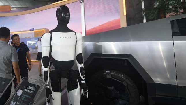 Visitors visit Tesla's Optimus humanoid robot at the 2024 Bund Conference in Shanghai, China, September 5, 2024