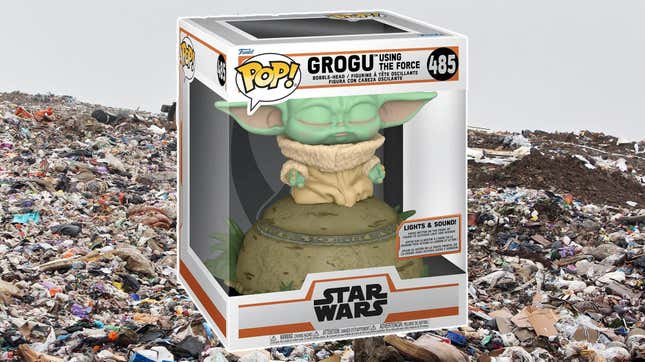 A Grogu Funko meditates in a landfill. 