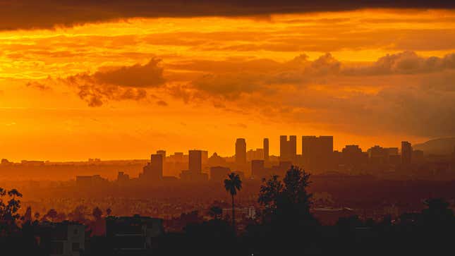 The sun rising over a smog-covered Los Angeles