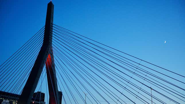 A photo of a suspension bridge in Boston at sunset. 