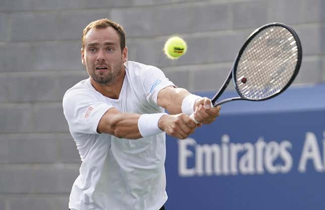 Aug 30, 2023; Flushing, NY, USA; Roman Safiullin hits to Tommy Paul of the United States on day three of the 2023 U.S. Open tennis tournament at USTA Billie Jean King National Tennis Center.