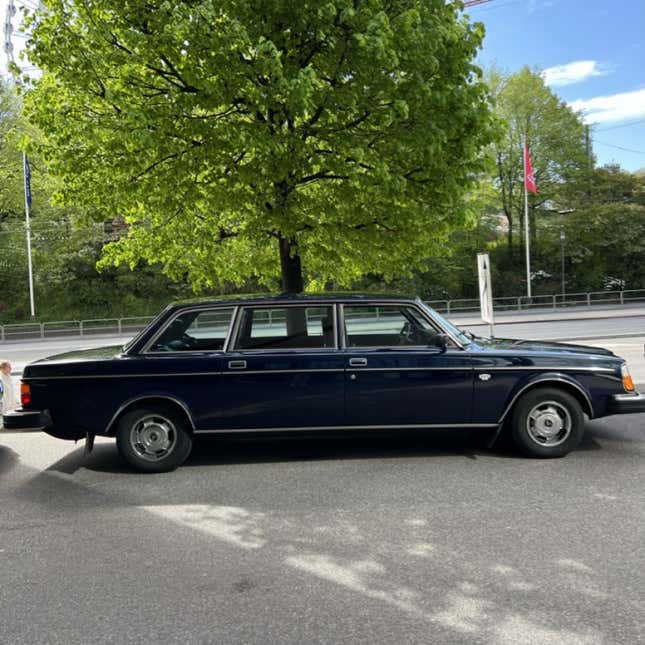 A photo of the side view of a Volvo limo. 