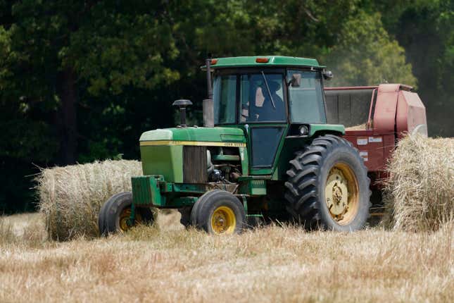 Farmer John Boyd Jr., runs his hay bailer at his farm in Boydton, Va., Thursday, May 27, 2021. Just two generations out of slavery, by 1910 Black farmers had amassed more than 16 million acres of land and made up about 14 percent of farmers. The fruit of their labors fed much of America. In 2021, they have fewer than 4.7 million acres. 