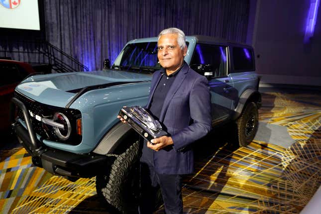 FILE - Kumar Galhotra, Ford President of the Americas and International markets group poses next to the Bronco off-road SUV, Tuesday, Jan. 11 2022 in Detroit. Ford said Wednesday, Oct. 18, 2023, is naming Galhotra as its chief operating officer as the automaker continues to deal with an ongoing strike by workers. (AP Photo/Carlos Osorio, File)