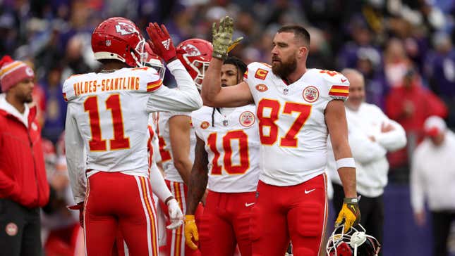 Tight end Travis Kelce of the Kansas City Chiefs talks with wide receiver Marquez Valdes-Scantling during warmups before playing the Baltimore Ravens in January.