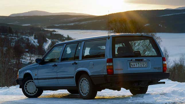 A blue Volvo 740 wagon parked in the snow 