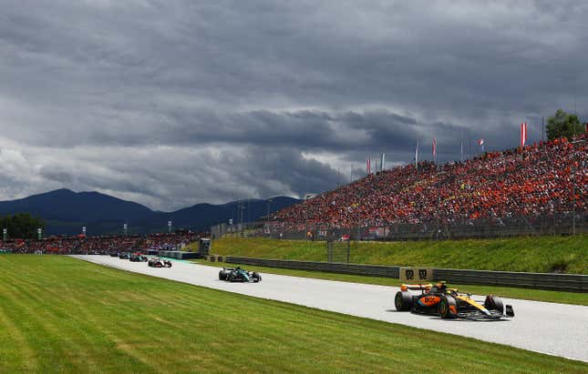 Lando Norris of Great Britain driving the (4) McLaren MCL60 Mercedes leads Fernando Alonso of Spain driving the (14) Aston Martin AMR23 Mercedes on track during the F1 Grand Prix of Austria at Red Bull Ring on July 02, 2023 in Spielberg, Austria