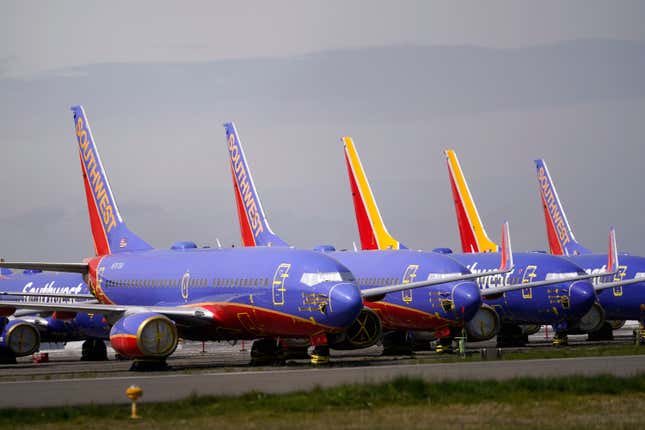 FILE - A line of Southwest Air Boeing 737 jets are parked near the company&#39;s production plant while being stored at Paine Field Friday, April 23, 2021, in Everett, Wash. Southwest Air reports earnings on Thursday, April 25, 2024. (AP Photo/Elaine Thompson, File)