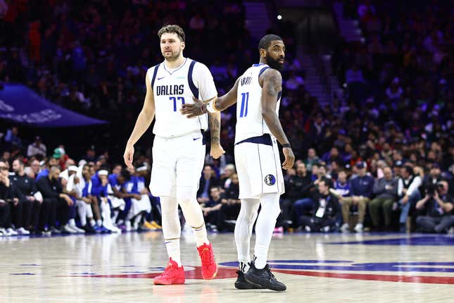 PHILADELPHIA, PENNSYLVANIA - FEBRUARY 05: Luka Doncic #77 of the Dallas Mavericks and Kyrie Irving #11 of the Dallas Mavericks look on during the fourth quarter against the Philadelphia 76ers at the Wells Fargo Center on February 05, 2024 in Philadelphia, Pennsylvania. NOTE TO USER: User expressly acknowledges and agrees that, by downloading and or using this photograph, User is consenting to the terms and conditions of the Getty Images License Agreement. (Photo by Tim Nwachukwu/Getty Images)