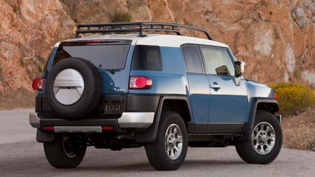 A photo of a blue Toyota FJ Cruiser SUV. 