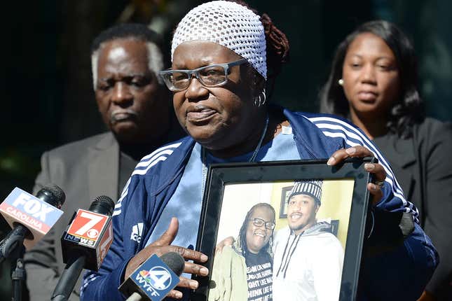 At a press conference on October 5, 2022, Beverly Lane, the victim’s mother, holds a picture of her son for the world to see.