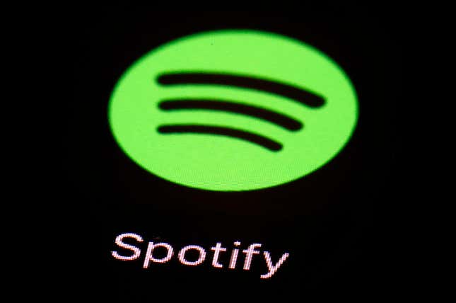 FILE- This March 20, 2018, file photo shows the Spotify app on an iPad in Baltimore. Spotify’s chief financial officer, Paul Vogel, is leaving next year, the music streaming service said, Friday, Dec. 8, 2023, — just days after the company announced its third round of layoffs for 2023. (AP Photo/Patrick Semansky, File)