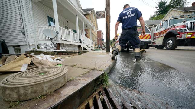 Clean up from flooding on Baldwin street in Bridgeville, Pa. continues after downpours and high winds from the remnants of Hurricane Ida, hit the area Wednesday, Sept. 1, 2021.