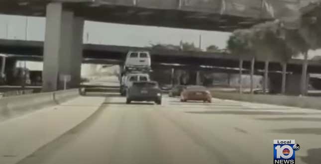 Image for article titled Watch This Car-Hauler Smash a Van Directly Into a Freeway Overpass