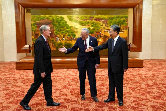 Visiting U.S. Senate Majority Leader Chuck Schumer, D-N.Y., center, introduces U.S. Sen. Mike Crapo, R-Idaho, left, to Zhao Leji, right, chairman of China&#39;s National People&#39;s Congress, before their bilateral meeting at the Great Hall of the People in Beijing, Monday, Oct. 9, 2023. (AP Photo/Andy Wong, Pool)