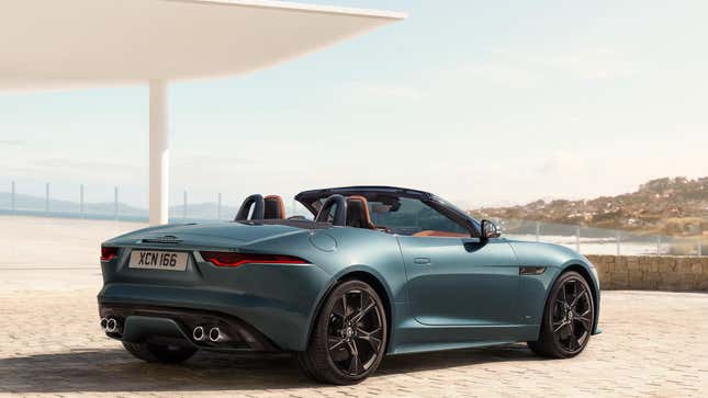 A blue Jag F Type parked with its top down 