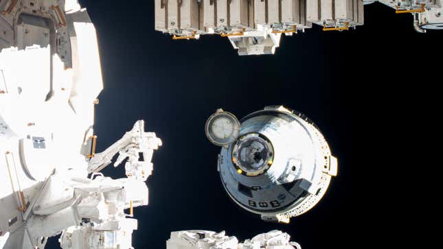 Boeing's uncrewed Starliner spaceraft backs away from the International Space Station moments after undocking from the Harmony module's forward port.