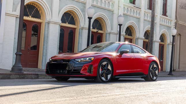 An Audi RS E-Tron GT driving down a city street 