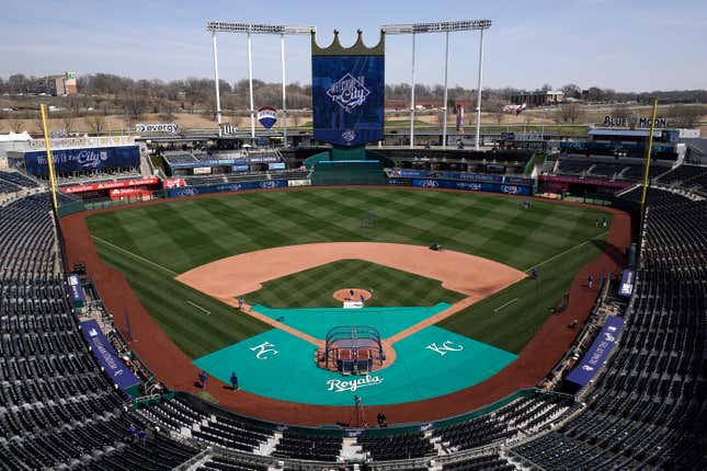 FILE - Members of the Kansas City Royals&#39; grounds crew work off the field in preparation for the baseball season March 29, 2023, at Kauffman stadium in Kansas City, Mo. Jackson County Executive Frank White vetoed an ordinance Thursday, Jan. 18, 2024, that would have put a 3/8th-cent sales tax renewal on the April ballot to fund sports stadiums for the Kansas City Chiefs and the Royals. (AP Photo/Charlie Riedel, File)