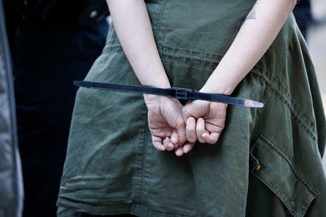 A protesters hands are zipped tied after being arrested at the Accenture Tower in Chicago, Monday, Nov. 13, 2023. Hundreds of Jewish peace activists and their allies converged during rush hour, blocking the entrance to the Israeli consulate and demanding U.S. support for an Israel cease-fire as battles rage in northern Gaza. (Anthony Vazquez/Chicago Sun-Times via AP) /Chicago Sun-Times via AP)