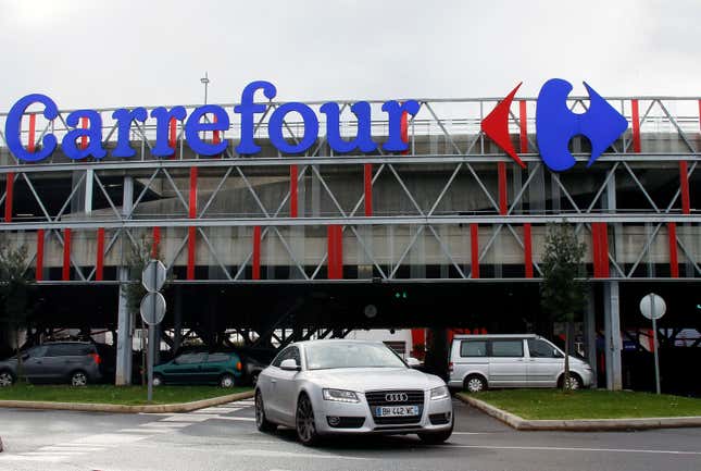 FILE - Car leaves a Carrefour supermarket in Anglet, southwestern France, on Jan.23, 2018. Global supermarket chain Carrefour will stop selling PepsiCo products in its stores in France, Belgium, Spain and Italy over price increases for popular items like Lay&#39;s potato chips, Quaker Oats, Lipton tea and its namesake soda. (AP Photo/Bob Edme, File)