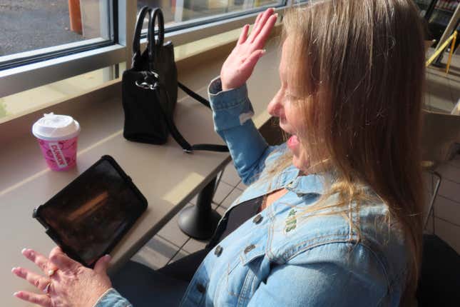 Elaine Vallaster reacts to a winning spin while playing an internet slots game on her tablet in Hazlet, N.J. on Nov. 24, 2023. Figures released on Tuesday, Feb. 20, 2024, by the American Gaming Association show that the U.S. commercial casino industry had its best year ever in 2023, winning $66.5 billion from gamblers. When figures from tribal casinos are tallied later this year, the combined total is expected to approach $110 billion for 2023. (AP Photo/Wayne Parry)