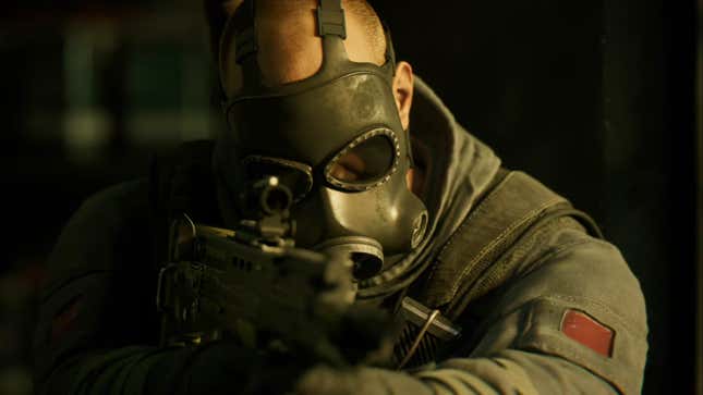 A cinematic screenshot of operator Sledge in action in Rainbow Six Siege X.