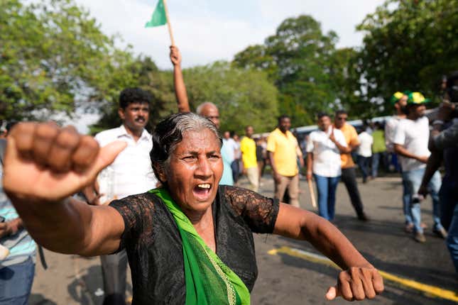 Supporters of Sri Lanka&#39;s main opposition shout slogans during a protest rally against high taxes and increases in electricity and fuel charges, in Colombo, Sri Lanka, Tuesday, Jan. 30, 2024. (AP Photo/Eranga Jayawardena)