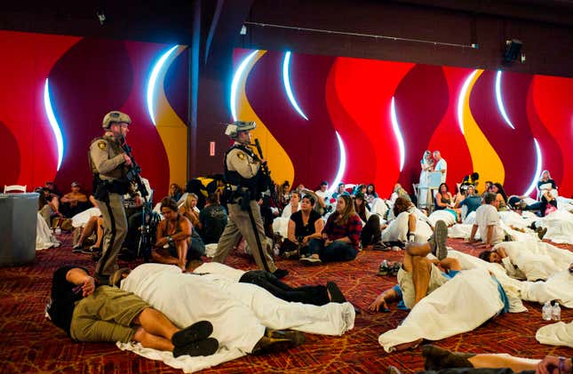 FILE - In this Oct. 2, 2017, file photo Las Vegas police sweep through a convention center area during a lockdown, at the Tropicana Las Vegas following an active shooter situation on the Las Vegas Strip. (Chase Stevens/Las Vegas Review-Journal via AP, File)