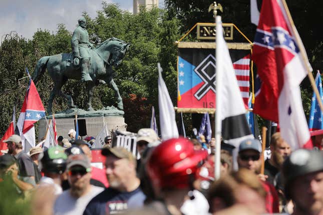 CHARLOTTESVILLE, VA - AUGUST 12: The statue of Confederate General Robert E. Lee stands behind a crowd of hundreds of white nationalists, neo-Nazis and members of the “alt-right” during the “Unite the Right” rally August 12, 2017 in Charlottesville, Virginia.