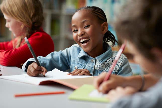 Black girl at school smiling 