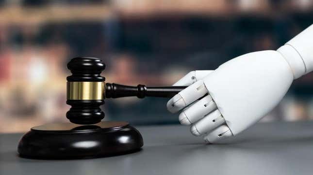A robot arm using a judge's gavel. 